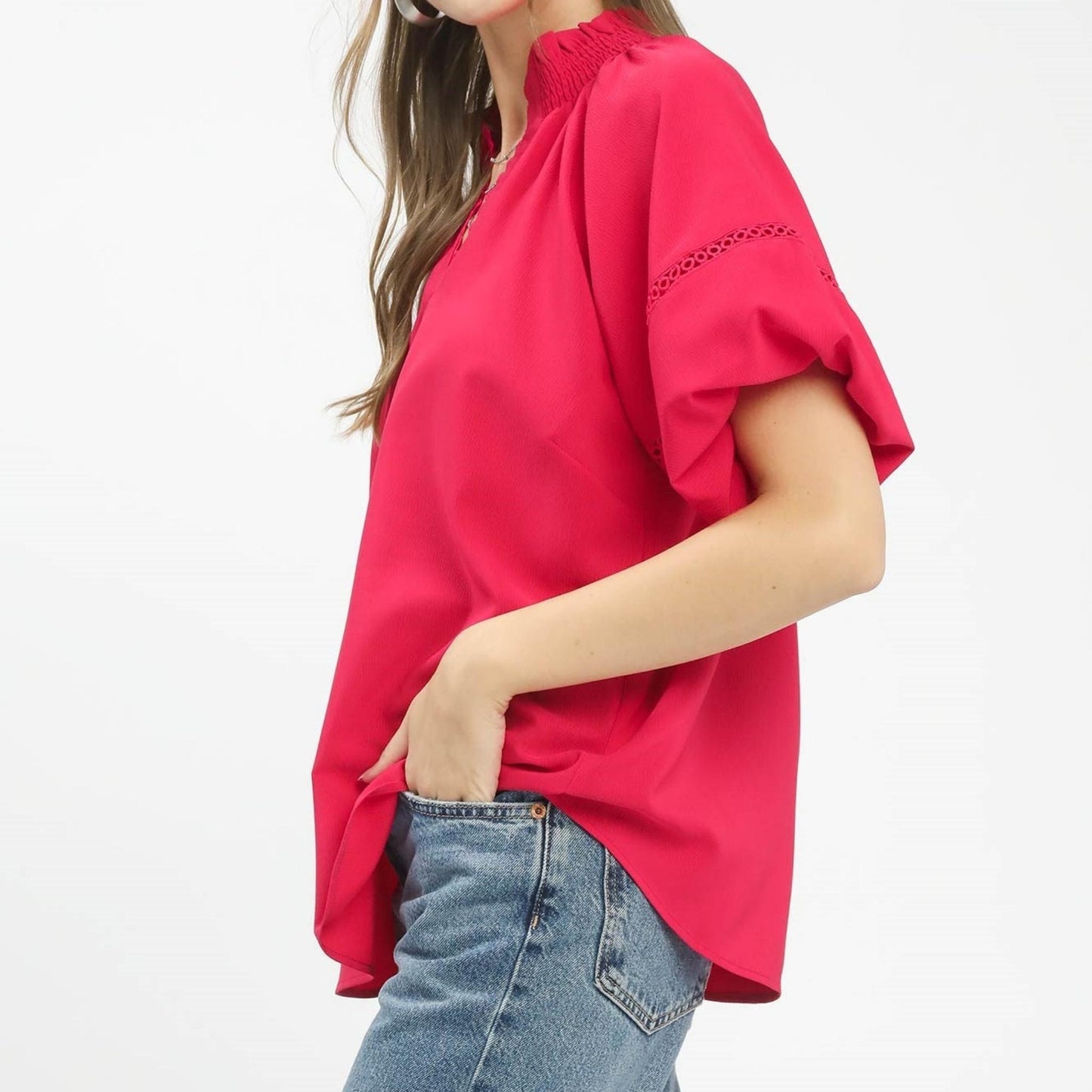 Side profile of the Umgee peasant top showing the billowy sleeve design and relaxed fit.