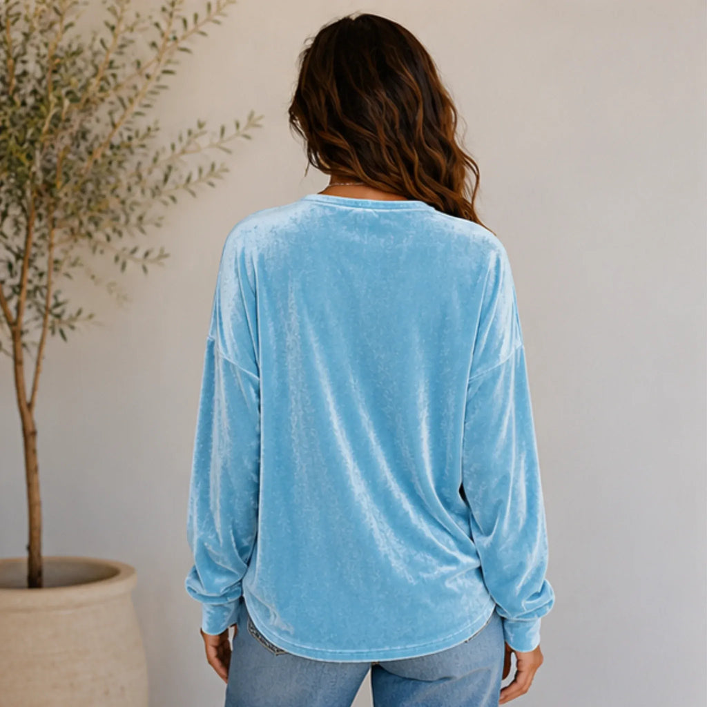 Back view of the women's sky blue Velvet Henley Sweatshirt featuring a relaxed silhouette and ultra-soft brushed velvet fabric.