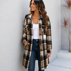 Woman wearing a coffee brown, black and cream plaid long cardigan shirt jacket