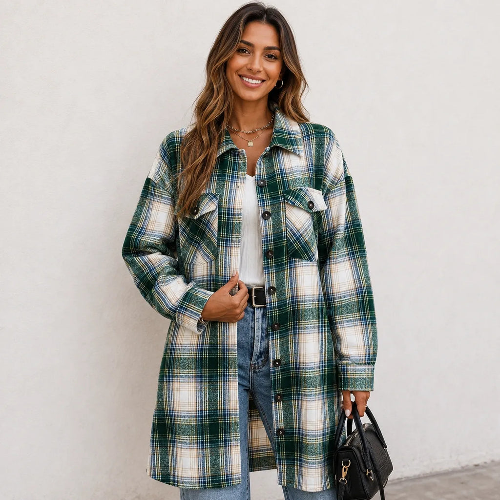 Woman wearing a green and cream plaid long cardigan shirt jacket with button front and pockets