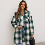 Woman wearing a green and cream plaid long cardigan shirt jacket with button front and pockets