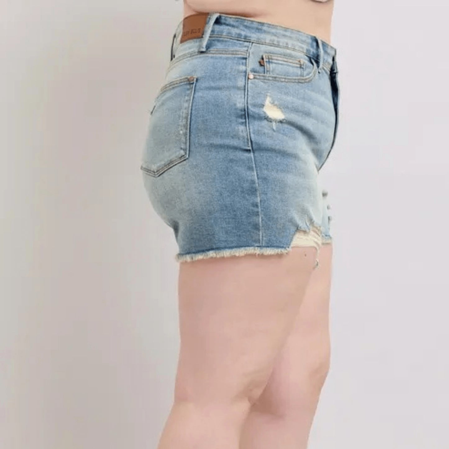 Side view of Judy Blue plus size shorts showing the comfortable high-rise fit.