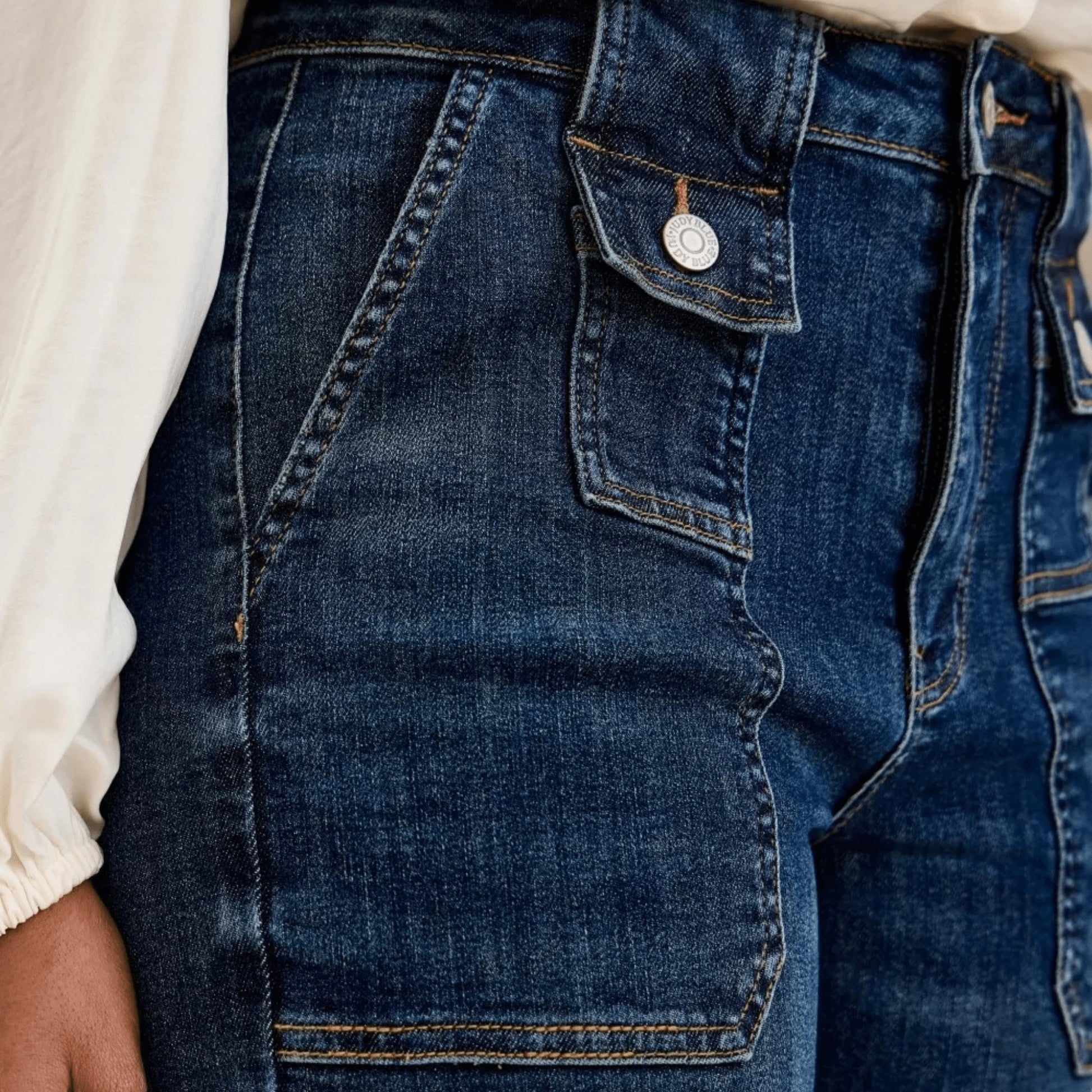 Front view of wide-crop utility jeans showing the patch pocket detail.