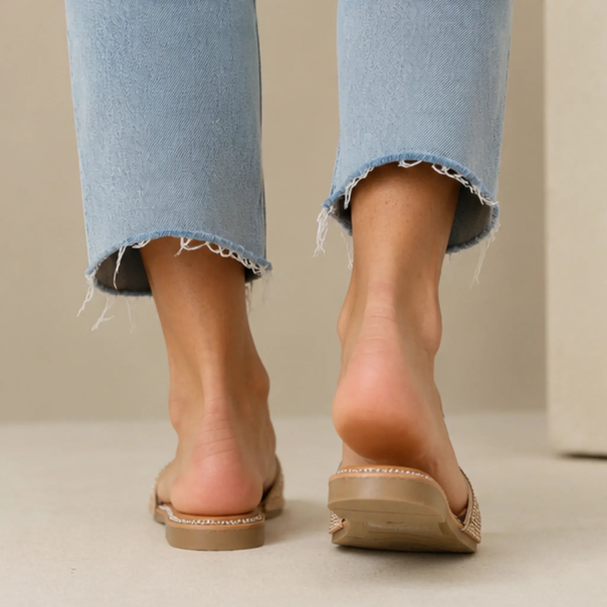 Back view of Wild Diva Rhinestone Open-Toe Flat Sandals in rose gold showing comfortable flat sole and rhinestone trim.