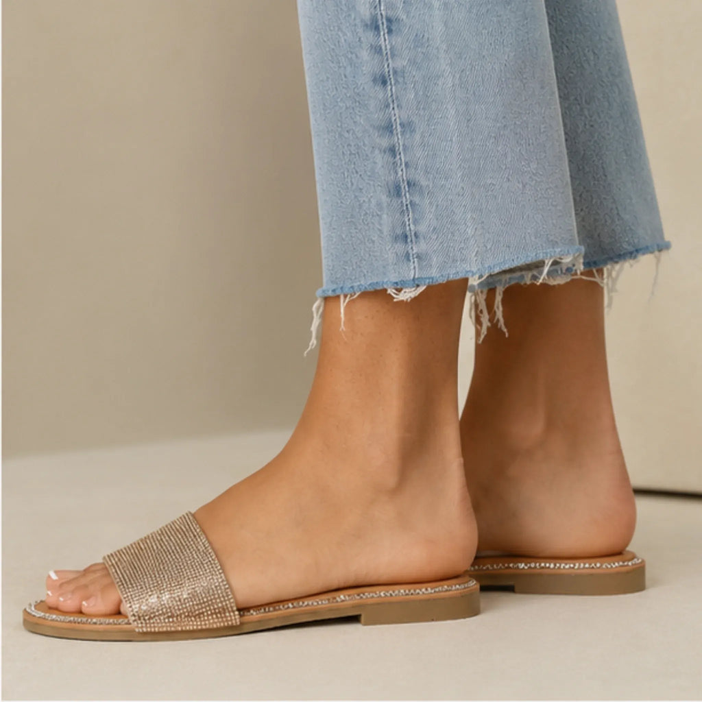 Side view of Wild Diva Rhinestone Open-Toe Flat Sandals in rose gold featuring sparkling rhinestones and flat slip-on design.