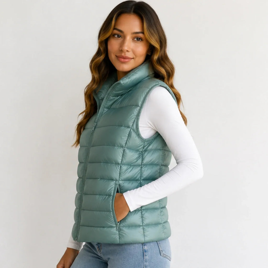Side view of women’s bean green oversized puffer vest jacket