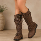 Women's brown leather mid-calf round toe lace-up boots with side zipper, buckle straps, and block heel.