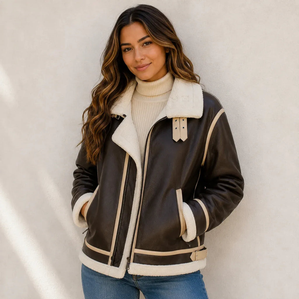 Women's brown faux shearling-lined leather jacket with cream trim and plush collar