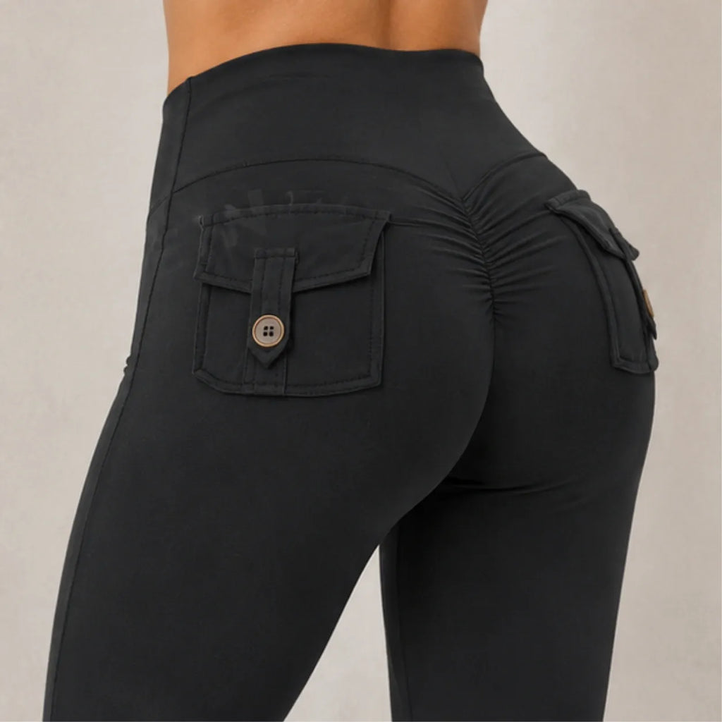 Close-up of women's flared yoga pants showing side cargo pockets and ruched back detail