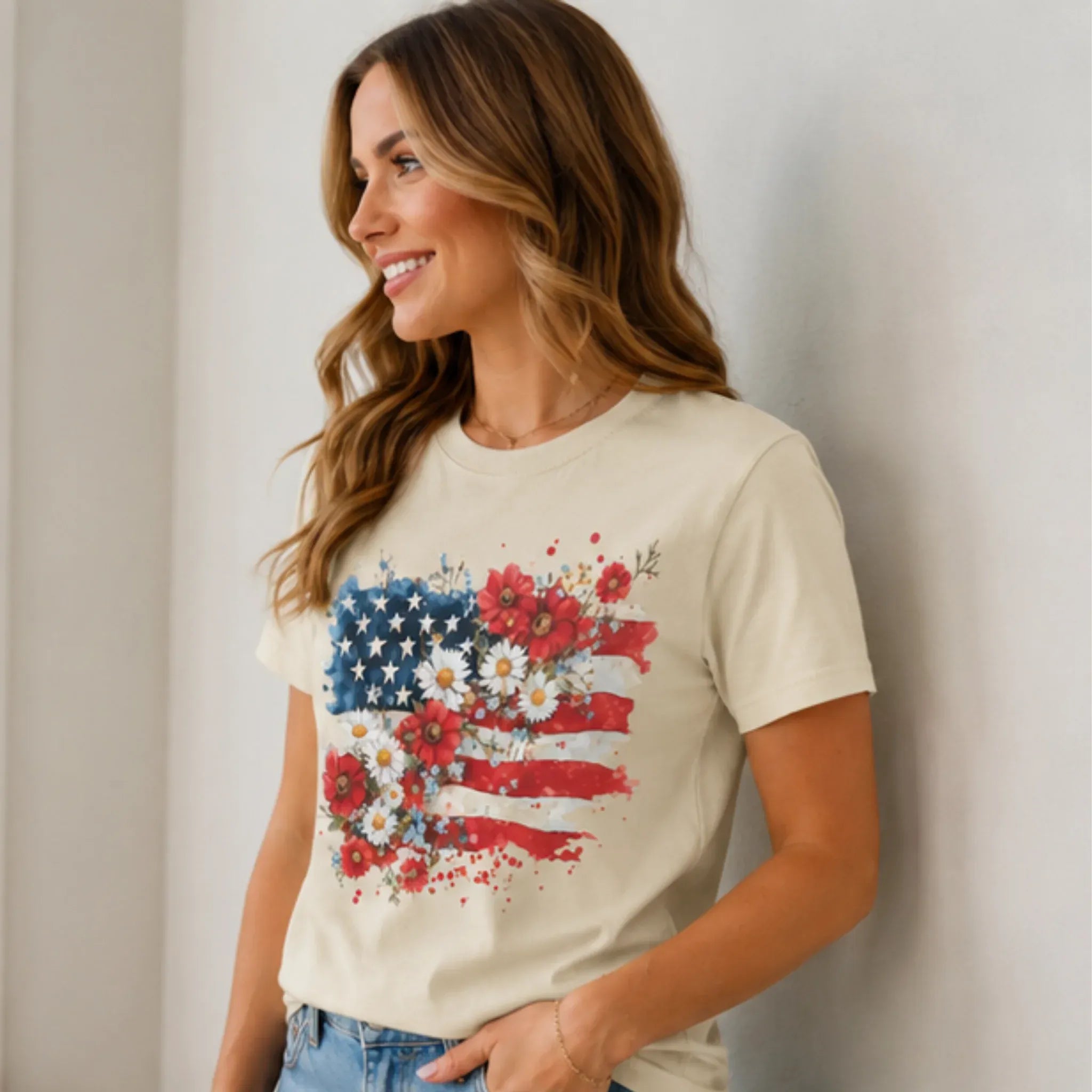Side view of woman wearing Women's Floral American Flag Graphic Tee in cream featuring a patriotic floral flag print.