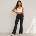 Women's high-waisted flared yoga pants in black with wide-leg silhouette