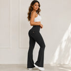 Side view of women's high-waisted flared yoga pants with high-rise waistband