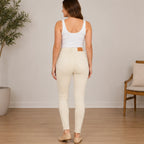 Women's Judy Blue garment dyed tummy control skinny jeans in bone, back view highlighting the classic five-pocket design and sculpting skinny fit.