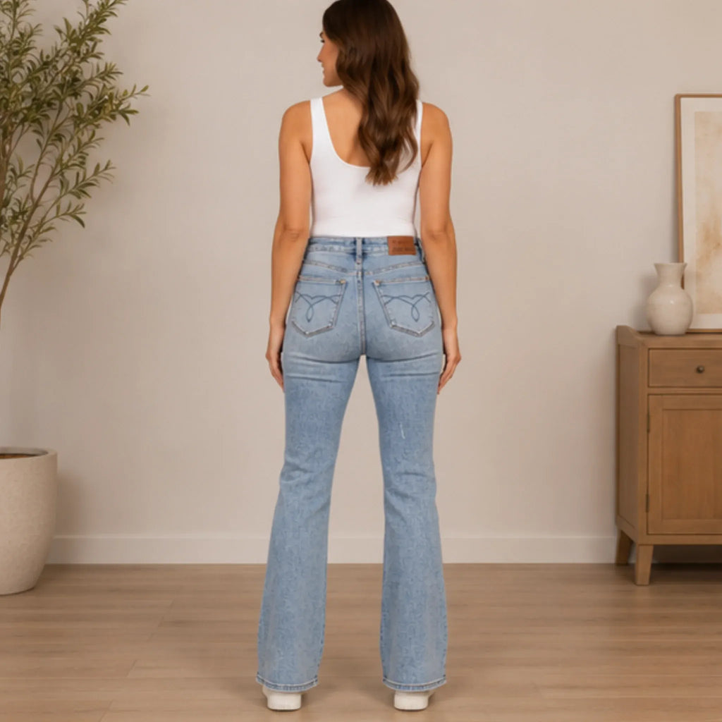 Women's Judy Blue tummy control back embroidered pocketed bootcut jeans back view highlighting embroidered pockets and a flattering fit.