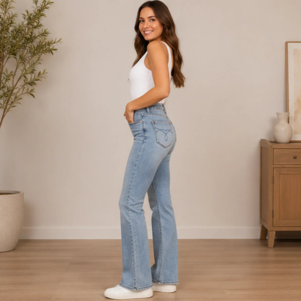 Women's Judy Blue tummy control back embroidered pocketed bootcut jeans side view showcasing the flattering bootcut fit in light wash denim.
