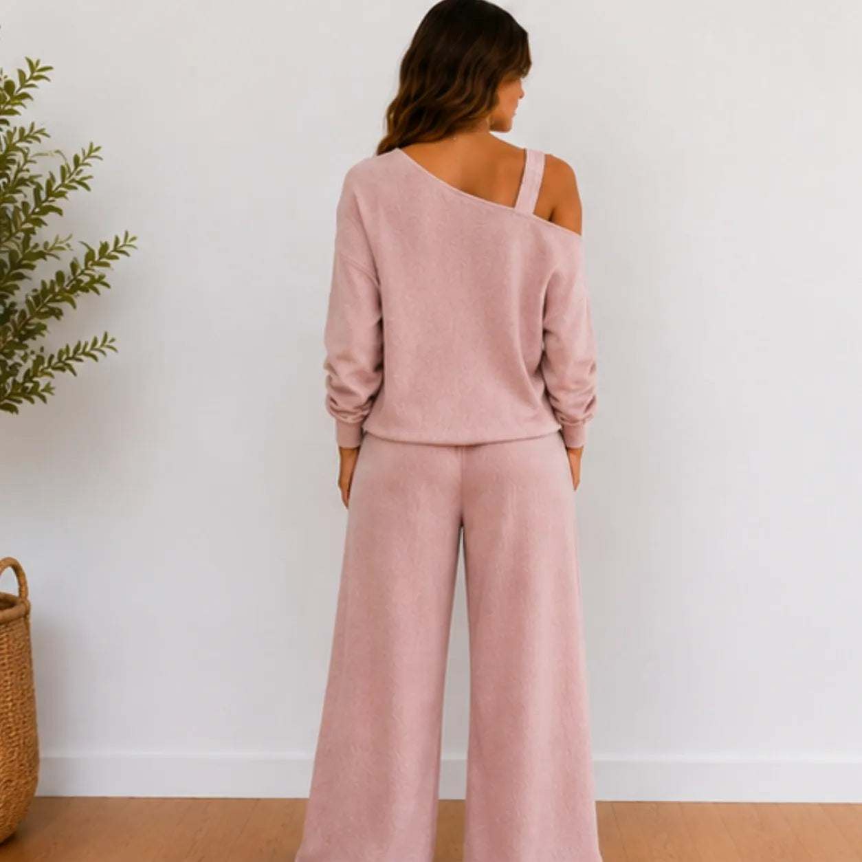 Back view of women’s pink linen-blend two-piece set with long sleeve top and full-length pants