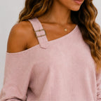 Close-up of pink linen-blend top showing shoulder strap detail and textured fabric