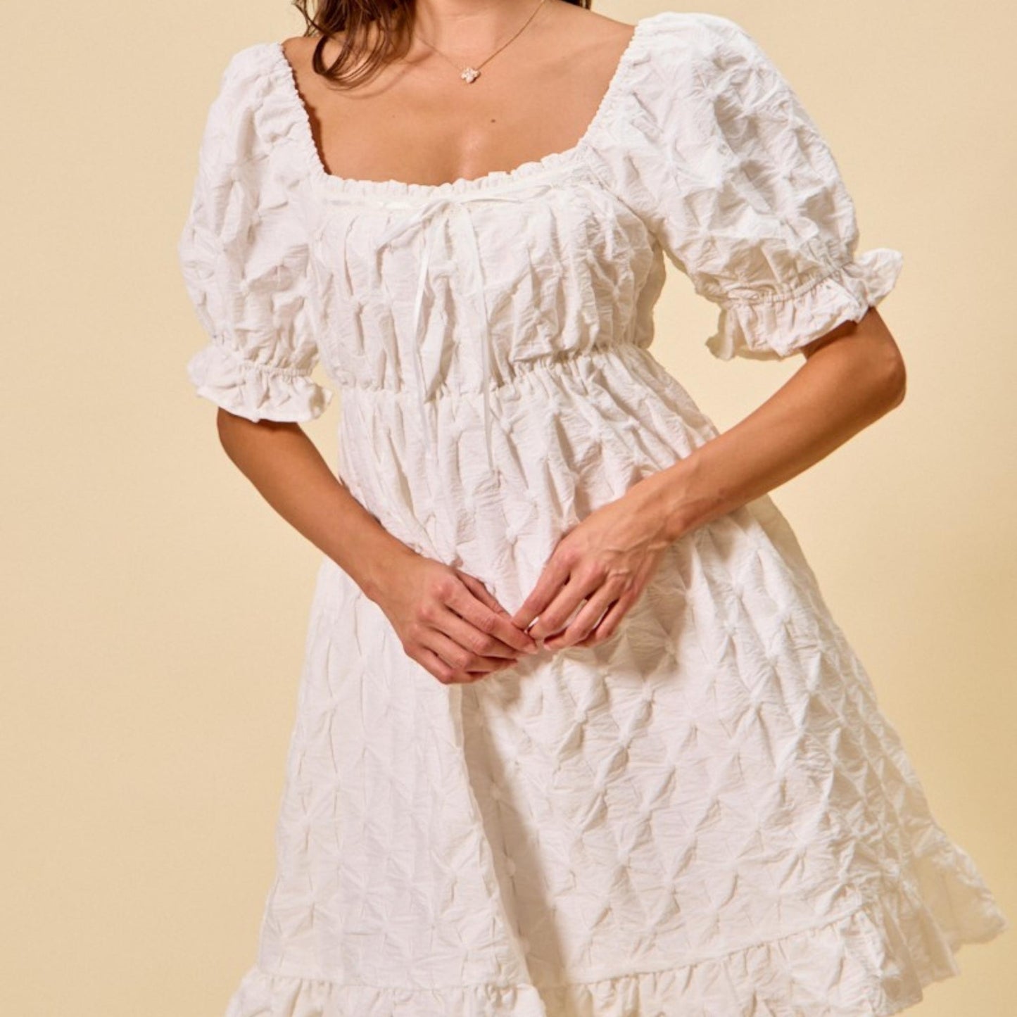 Full-length view of the elegant SO ME off white ruched bust mini dress.