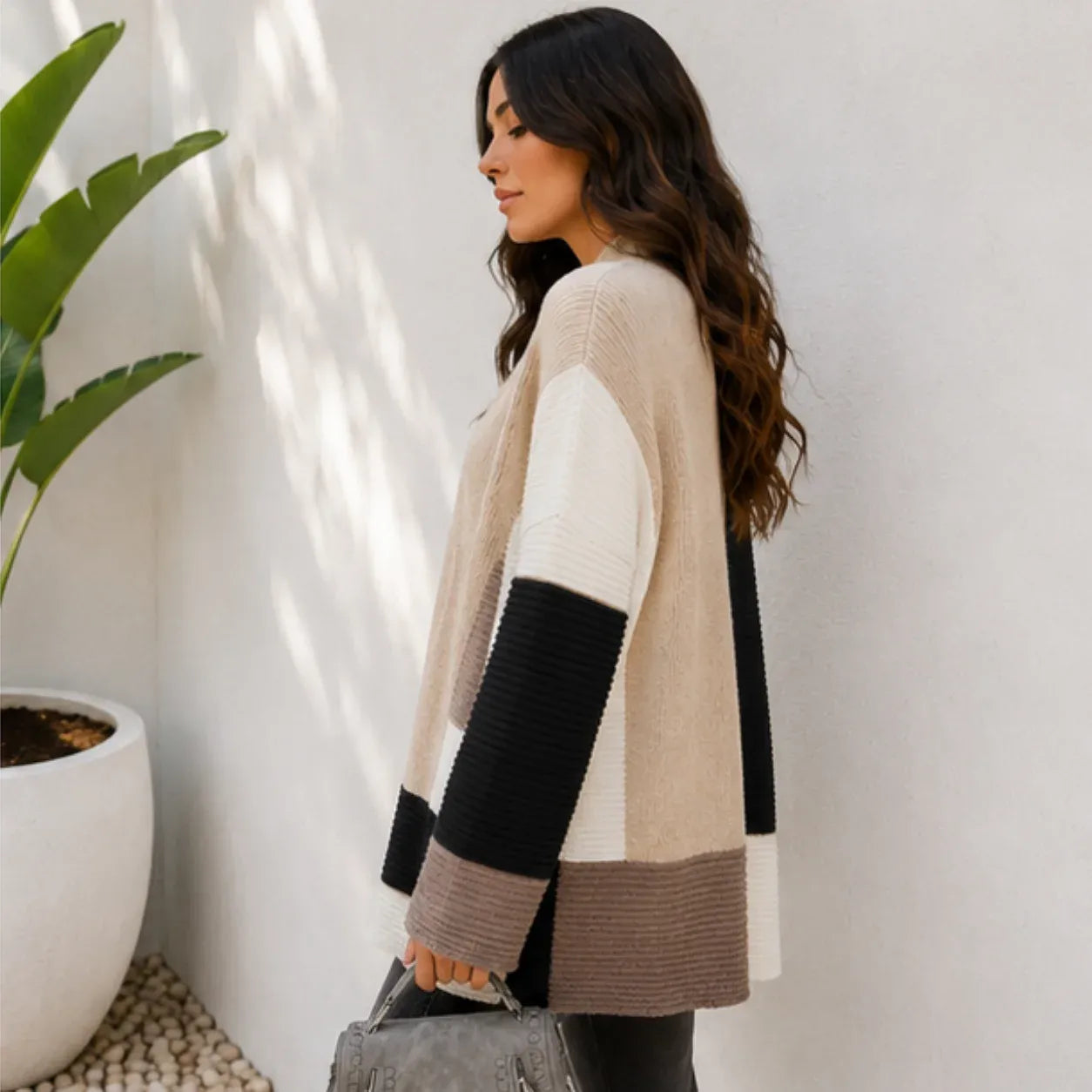 Women's oversized color block cardigan in black, cream, and taupe, side view