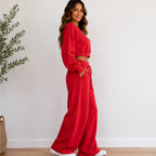Women’s red crop sweatshirt and wide-leg pants set side view
