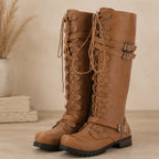 Women's yellow leather mid-calf round toe lace-up boots with side zipper, buckle straps, and block heel.