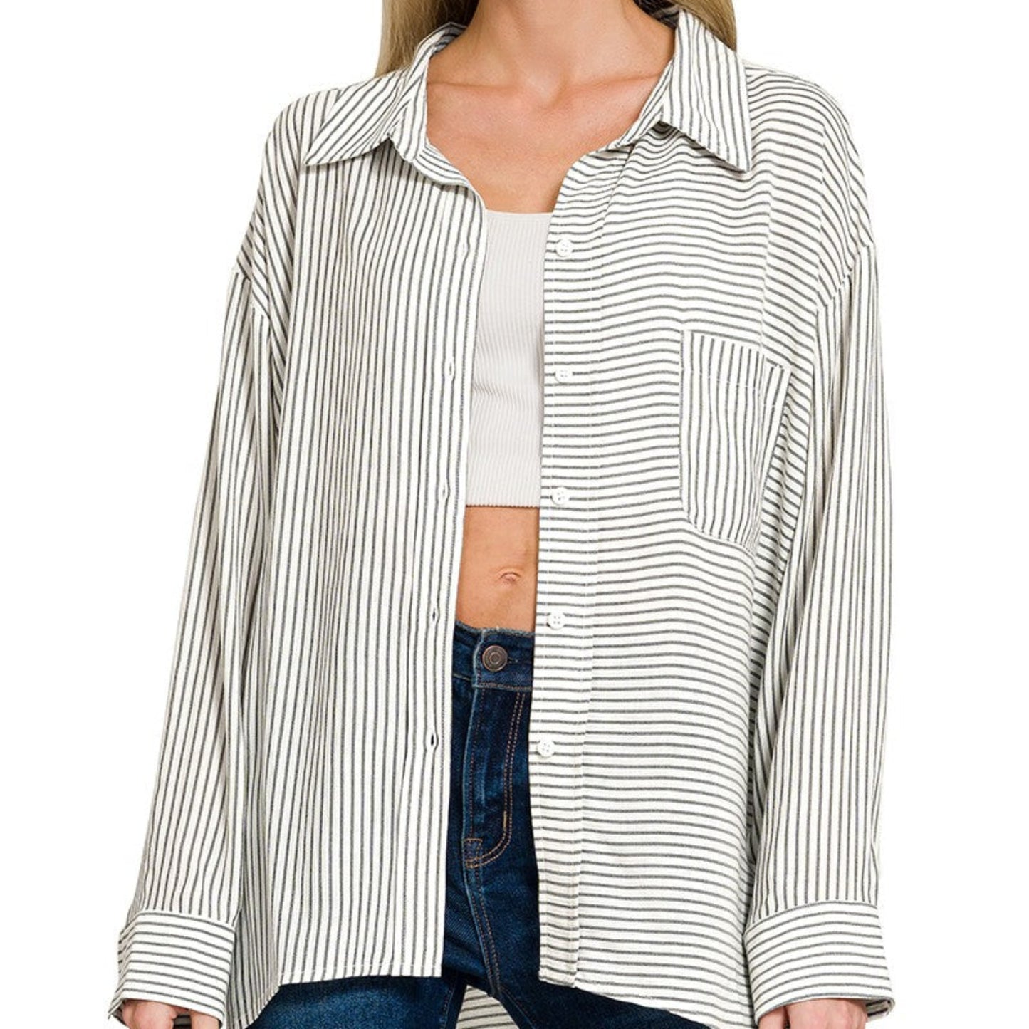 Front view of the black and white striped button-down shirt featuring a chest pocket.
