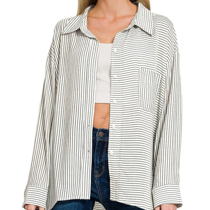 Front view of the black and white striped button-down shirt featuring a chest pocket.