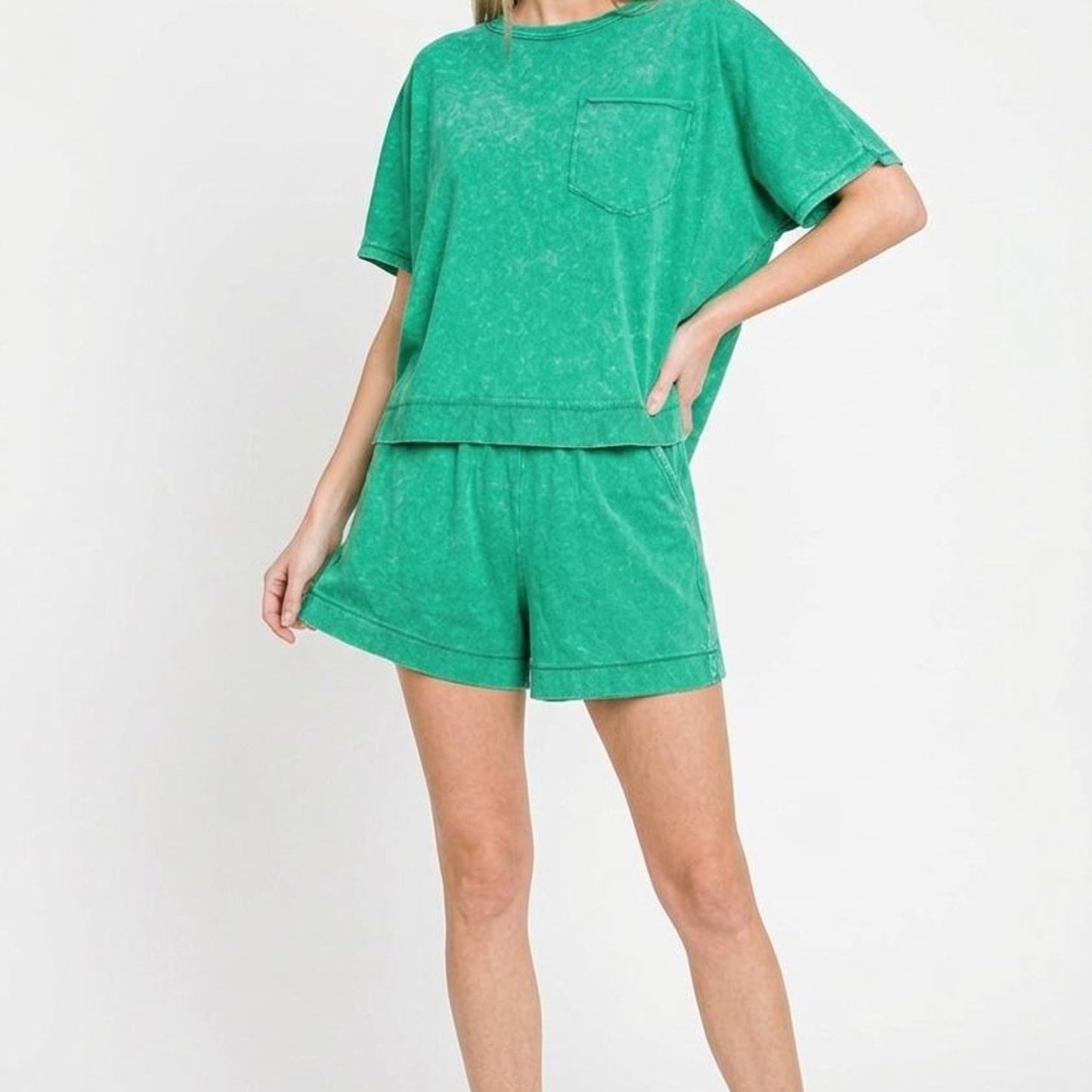 Woman wearing a green outfit on a white background