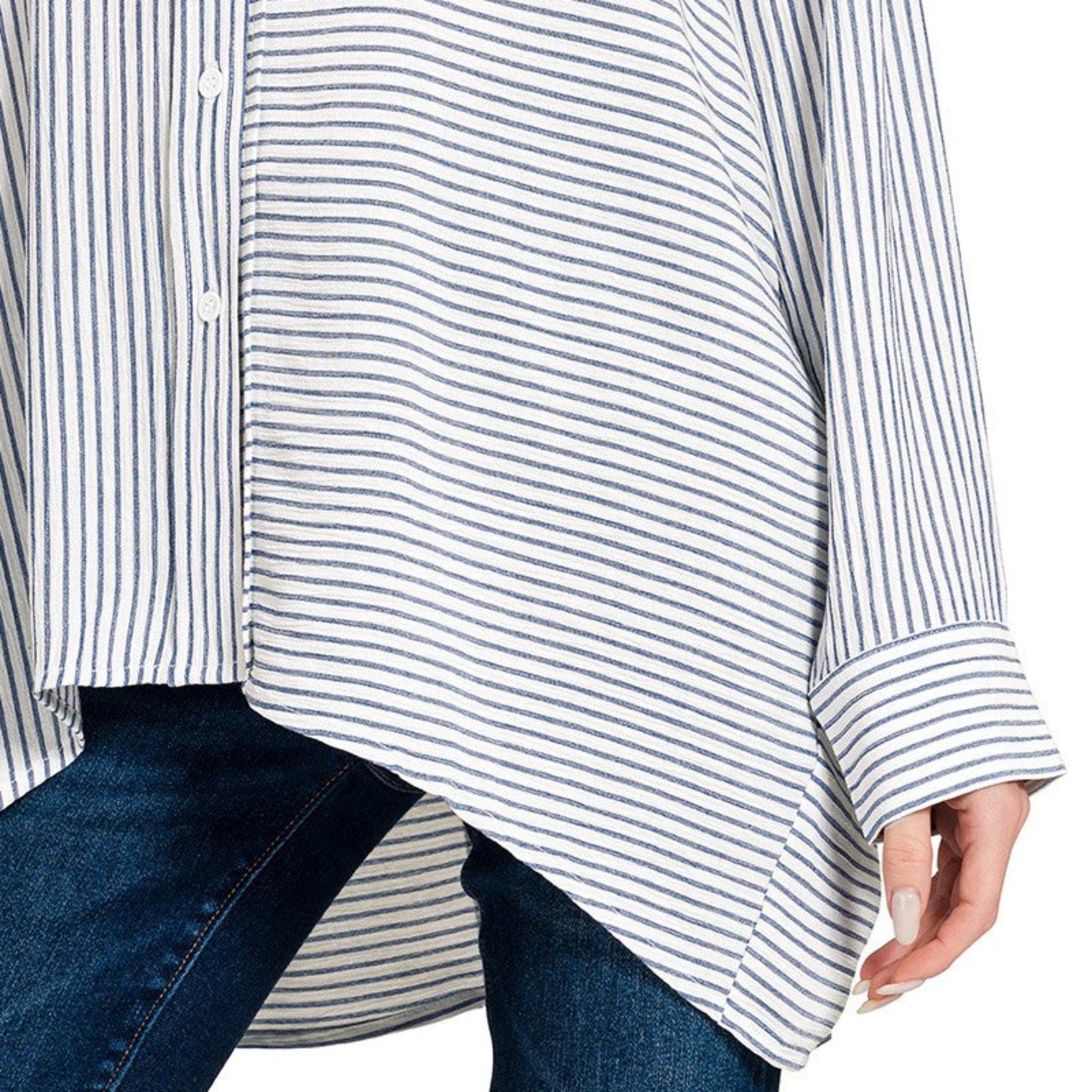 A professional boutique display of the blue striped button-down shirt on a minimalist hanger.