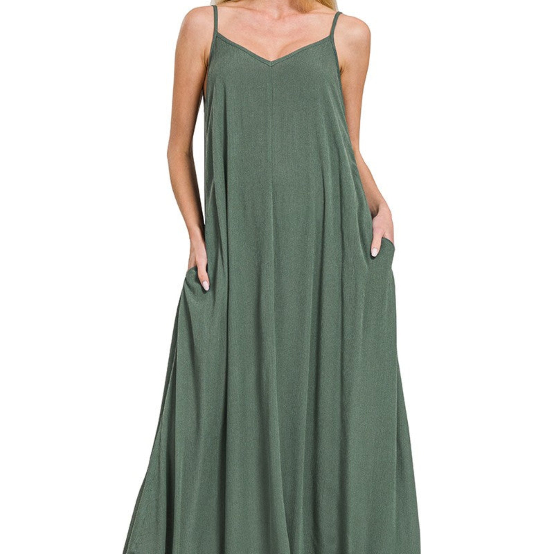 Professional boutique display of the ash jade maxi dress on a minimalist wooden hanger.