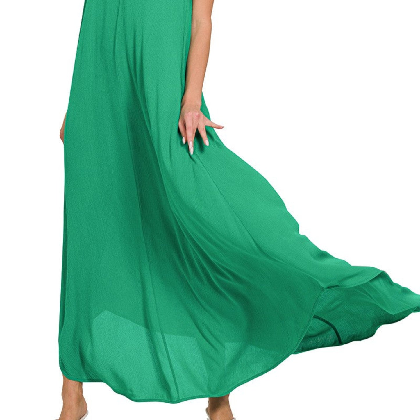 A professional boutique display of the K green maxi dress on a minimalist hanger.